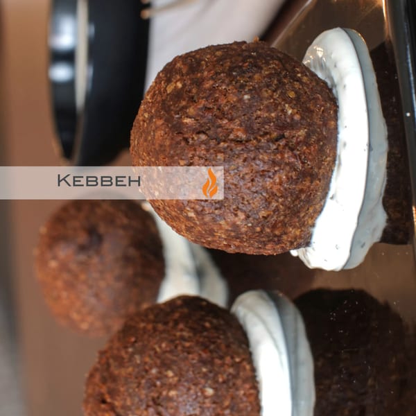 Three Byblos Kebbeh, fried bulgur and minced meat balls, served with a creamy white sauce.