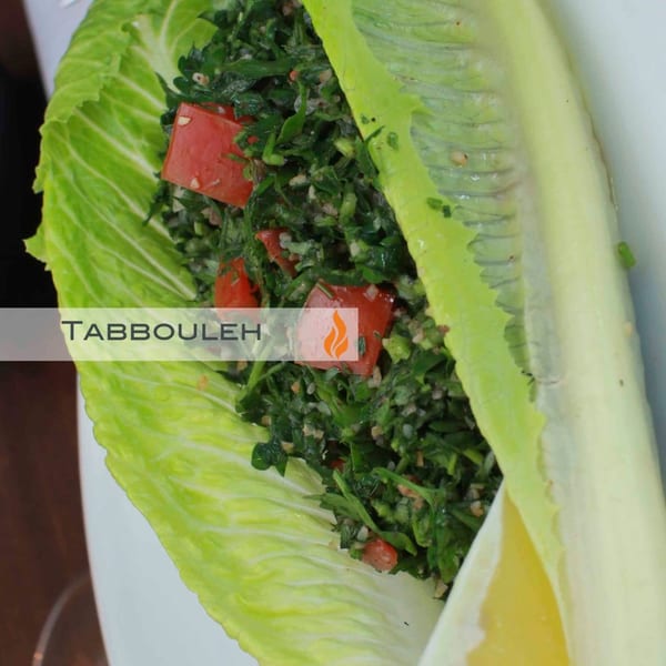 Byblos' Mediterranean tabbouleh salad, with fresh parsley, tomatoes, and bulgur, served in a lettuce cup.